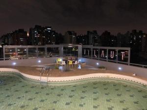 a pool on the roof of a building at night at Temporarios NYC2 - Centro CBA in Cordoba