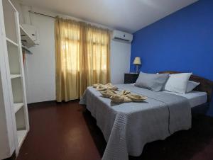 Posteľ alebo postele v izbe v ubytovaní Iguana Street Houses