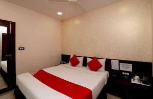 Ένα ή περισσότερα κρεβάτια σε δωμάτιο στο OYO Flagship Sweet Dreams Resort