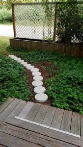 a row of stepping stones in a garden at Funky Little Shack in Orick
