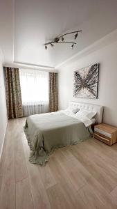 Katil atau katil-katil dalam bilik di Luxe Apartments on Stepnoy