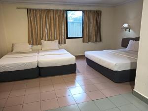 Krevet ili kreveti u jedinici u objektu OYO 90860 Wawasan Inn
