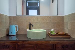 Ένα μπάνιο στο Asri BALI SANUR Premier Suites