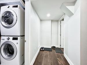 a laundry room with a washer and dryer at Exclusive 2 BR Furnished Apartment in Milton Ontario Canada in Milton