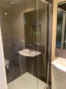 a bathroom with a sink and a shower at The Yarra Valley Couple Escape in Yarra Glen