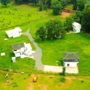 an aerial view of a house in a field at Camp Banas Naudhiya in Budia