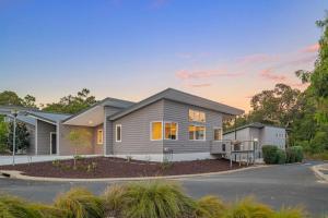 a house in a subdivision with a driveway at Willy Wagtail @ Cape Villas in Dunsborough