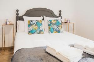 Ένα ή περισσότερα κρεβάτια σε δωμάτιο στο Apartamentos Luis +21 φωτογραφίες
