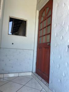 an empty room with a door and a window at Beytell's Nest in Richards Bay