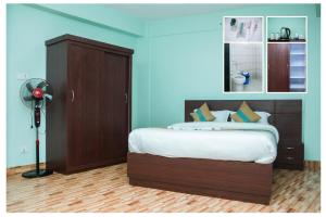 Postel nebo postele na pokoji v ubytování Yaksa Hotel Pvt. Ltd.