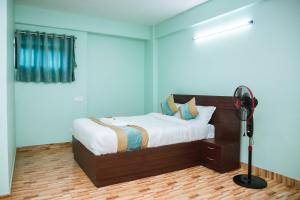 Postel nebo postele na pokoji v ubytování Yaksa Hotel Pvt. Ltd.