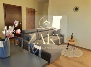 a living room with a couch and a table at Apartmány Zaky in Vrbov