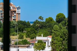 a view from a window of a building and trees at Apartamento Denia Marina Real III T in Denia