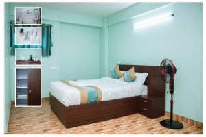 Postel nebo postele na pokoji v ubytování Yaksa Hotel Pvt. Ltd.