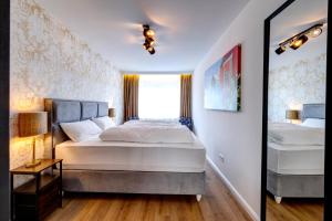 Ένα ή περισσότερα κρεβάτια σε δωμάτιο στο Luxusapartment, Rüttenscheid, zwei Parkplätze