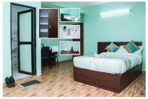 Postel nebo postele na pokoji v ubytování Yaksa Hotel Pvt. Ltd.