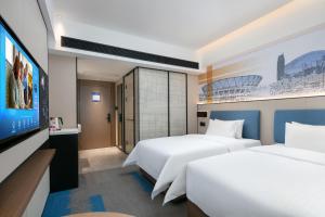 Voodi või voodid majutusasutuse Hampton by Hilton Foshan Dali toas