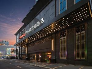 a building with a sign on the side of it at Hampton by Hilton Foshan Dali in Foshan