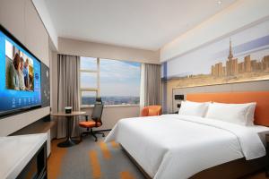 Voodi või voodid majutusasutuse Hampton by Hilton Foshan Dali toas