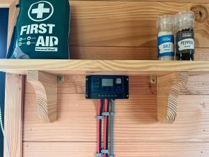 a first air system on a shelf with bottles of beer at Beaver Tail Cabin in Hereford