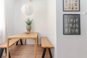 a table and two chairs in a room at Riverside Appartement - City Center in Krems an der Donau
