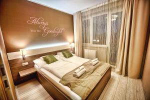 Posteľ alebo postele v izbe v ubytovaní Zafír Apartman Sárvár