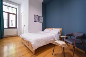 Postel nebo postele na pokoji v ubytování Gallery Hostel Tbilisi
