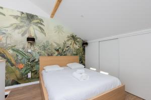 En eller flere senge i et værelse på Dify Terracotta - Villeurbanne