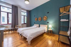 Postel nebo postele na pokoji v ubytování Gallery Hostel Tbilisi