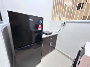 Traders Garden , cheras Trader square 3 bedroom Balakong serdang的电视和/或娱乐中心
