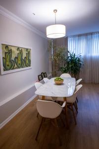 a dining room with a white table and chairs at Spacious luxury flat in the heart of Istanbul in Istanbul