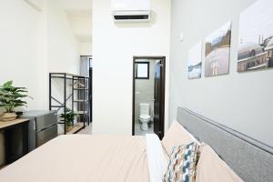 谷園酒店公寓Good Garden Apartment房間的床