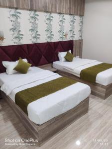 Postel nebo postele na pokoji v ubytování Hotel Praj Paradise
