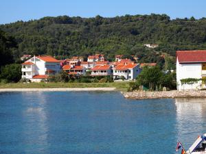 a town on the shore of a body of water at Villas Rab Palit in Rab