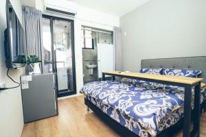 谷園酒店公寓Good Garden Apartment房間的床