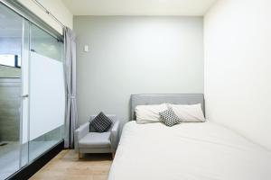 谷園酒店公寓Good Garden Apartment房間的床