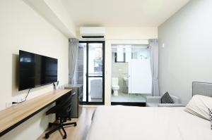 谷園酒店公寓Good Garden Apartment電視和／或娛樂中心
