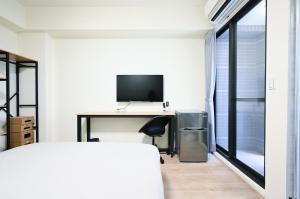 谷園酒店公寓Good Garden Apartment電視和／或娛樂中心