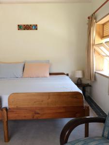 מיטה או מיטות בחדר ב-Dreamville Beach Homestay