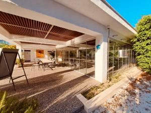 a house with glass doors and a patio at Agora Paradise in Side