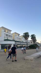 a group of people standing around in a parking lot at Waterlife in Lisbon