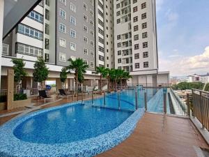 a large swimming pool in front of a building at TR Residence MRT/Monorail/LRT/KLCC in Kuala Lumpur