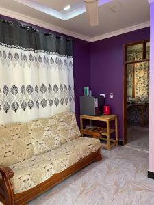 a living room with a couch and a table at Bagamoyo Home Stay in Bagamoyo