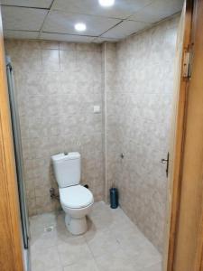 a small bathroom with a toilet and a shower at Lara Beach 600 m, 80 m2 flat, 2 bedroom, Netflix in Antalya