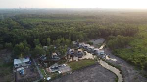 an aerial view of a house in the woods at TimeOut Island Glamping Resort in Ấp Binh Trung
