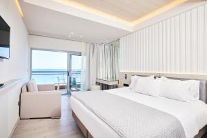 A bed or beds in a room at Mediterranean Hotel
