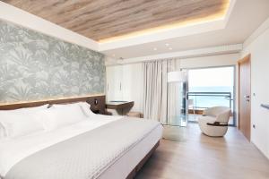 A bed or beds in a room at Mediterranean Hotel