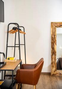 a room with a desk and a chair and a mirror at alle Stelle b&b by FM, Capri Stays in Anacapri