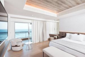 A bed or beds in a room at Mediterranean Hotel