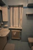 a bathroom with a sink and a radiator at Campiglio Tre Sassi in Madonna di Campiglio